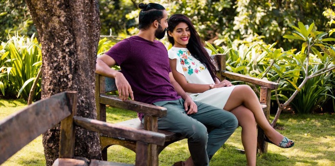 Free Photo | Love story of indian couple posed outdoor sitting on bench  together